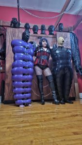 Mistress Simone's encased rubber balloon slave